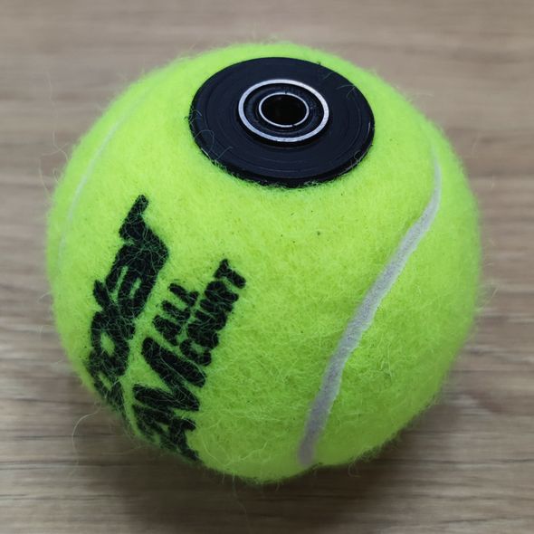 Tennis ball with sleeve for tennis simulators